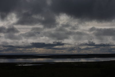 Scenic view of sea against cloudy sky