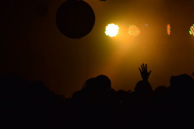 Silhouette man against sky at night