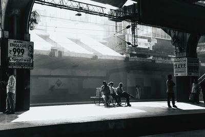 People waiting at railroad station platform