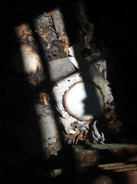 High angle view of rusty metal on wood