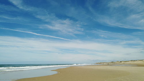 Scenic view of beach against sky