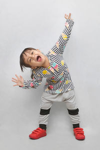 Boy wearing hat against white background