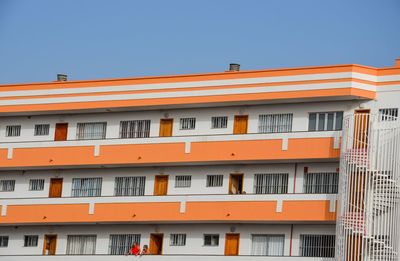 View of residential buildings against clear sky