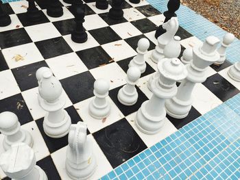 High angle view of chess pieces on floor