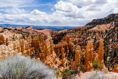 Panoramic view of landscape against cloudy sky