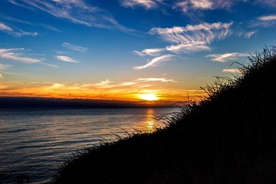 View of beach at sunset