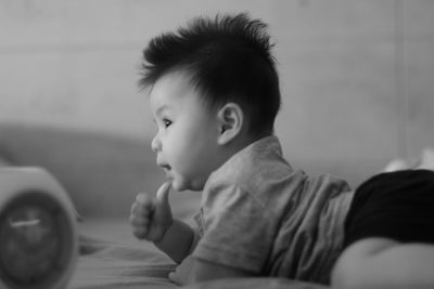 Portrait of cute boy looking at home