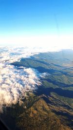 High angle view of landscape against blue sky