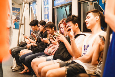 Group of people sitting outdoors