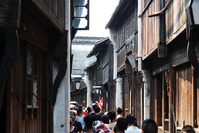 Crowd amidst historical buildings