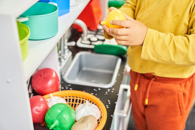 Midsection of man holding food