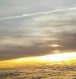 Scenic view of landscape against sky at sunset