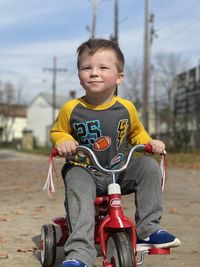 Portrait of boy riding bicycle