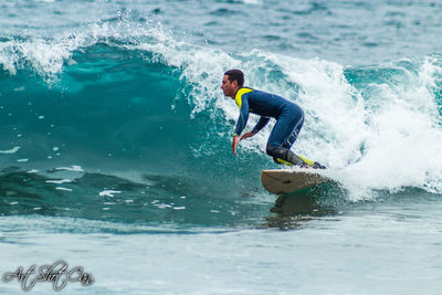 Side view of man surfing in sea