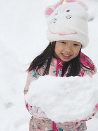 Portrait of smiling girl in snow