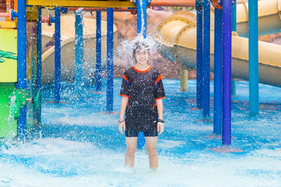 Full length of man standing in swimming pool