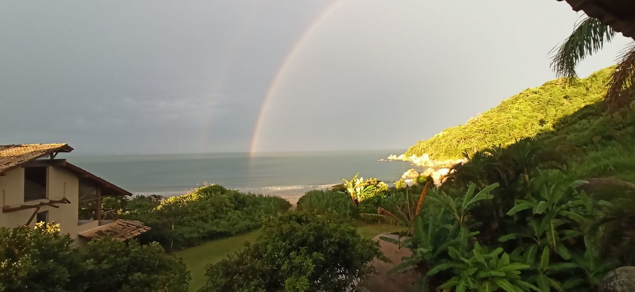 SCENIC VIEW OF RAINBOW OVER SEA