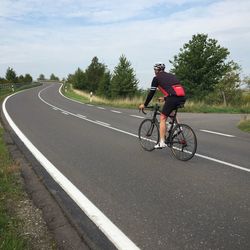 Person riding bicycle on road