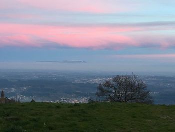 Scenic view of landscape against sky during sunset