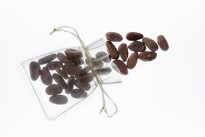 Close-up of coffee beans against white background