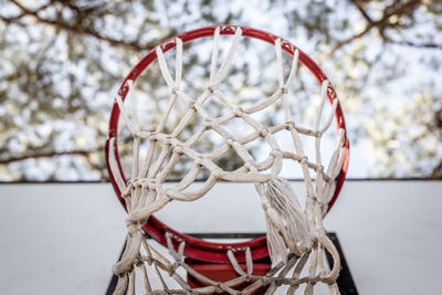 Close-up of basketball hoop against sky