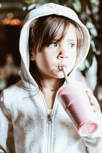 Portrait of girl holding ice cream