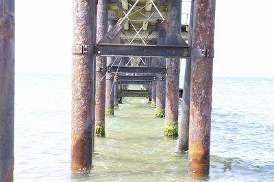 Pier over sea against sky