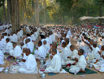 Group of monks praying with joined hands