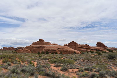 Rock formations in desert against sky