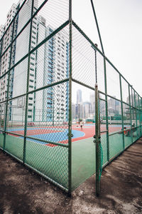 View of soccer field seen through chainlink fence