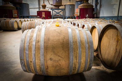 Panoramic shot of wine bottles on wooden table