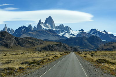 Road amidst mountains against sky fitz roy el chalten patagonia argentina