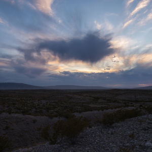 Scenic view of field against sky during sunset