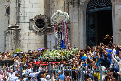 Catholics are seen following the procession in honor of conceicao da praia 