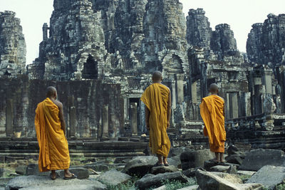 Rear view of statue against temple building