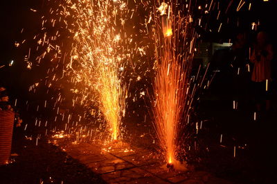 Firework display at night