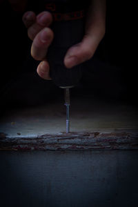 Midsection of man preparing food in kitchen