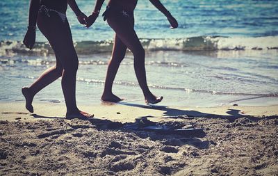 Low section of women on beach