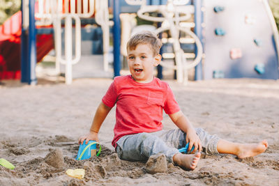 Portrait of happy boy playing