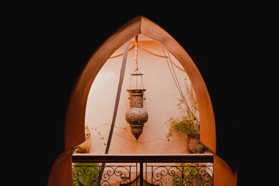Low angle view of statue against black background