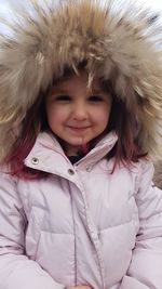 Portrait of girl wearing fur coat