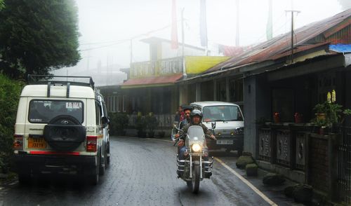 Cars on street in rainy season