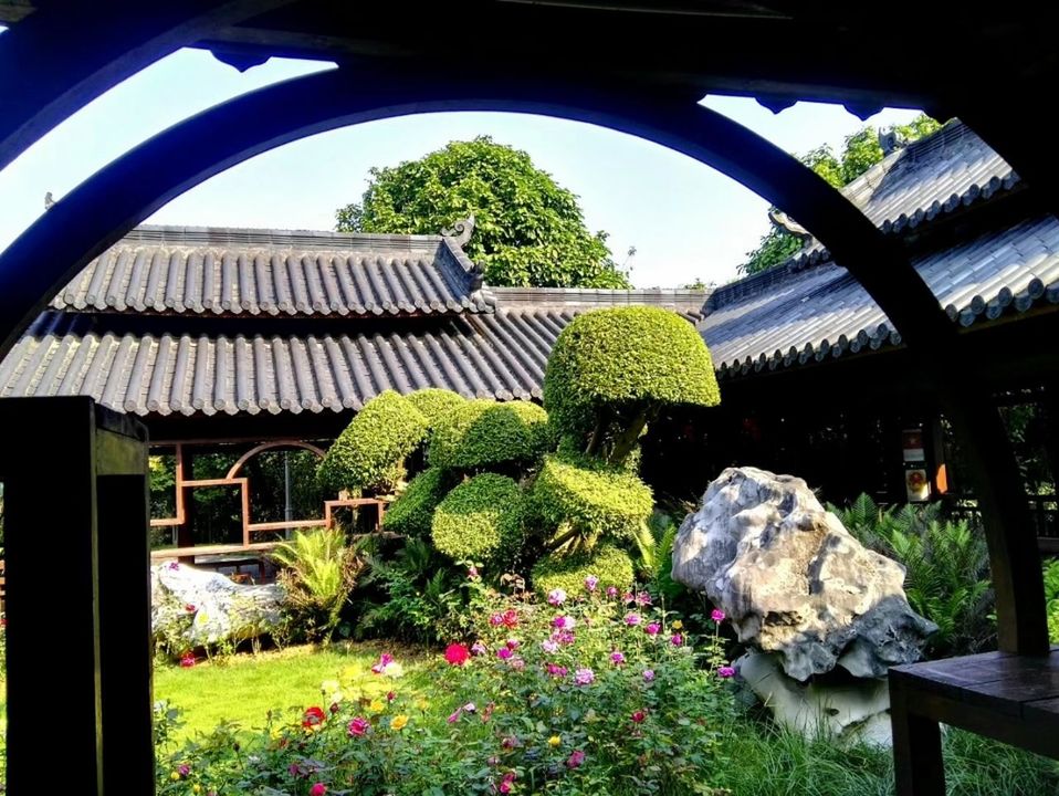 plant, architecture, built structure, nature, building exterior, no people, formal garden, tree, day, garden, growth, religion, green color, outdoors, building, flower, place of worship, belief, flowering plant, spirituality, ornamental garden