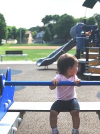 Full length of woman playing in playground