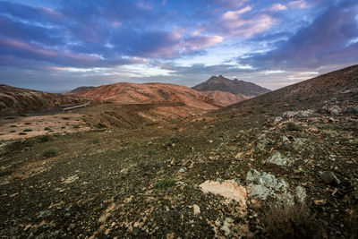 View of mountain range against cloudy sky