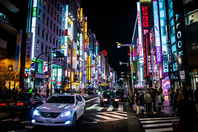 Street amidst buildings in city at night