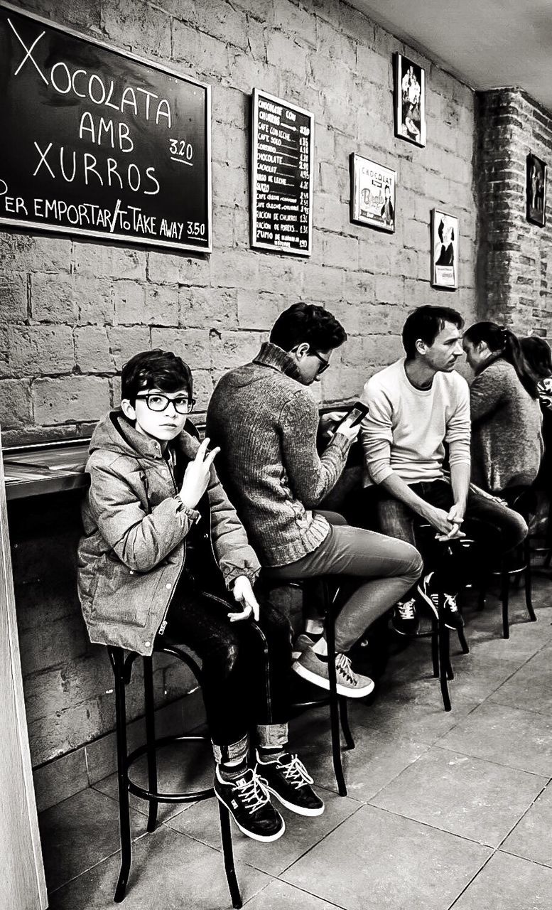 PEOPLE SITTING ON FLOOR