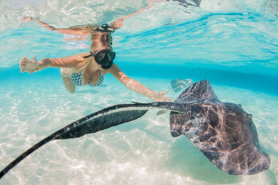 Woman swimming in sea
