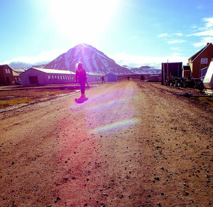 Man on mountain against sky