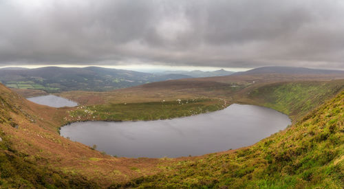 Panoramic view on upper and lower lakes lough bray sugarloaf and mountain range in wicklow mountains